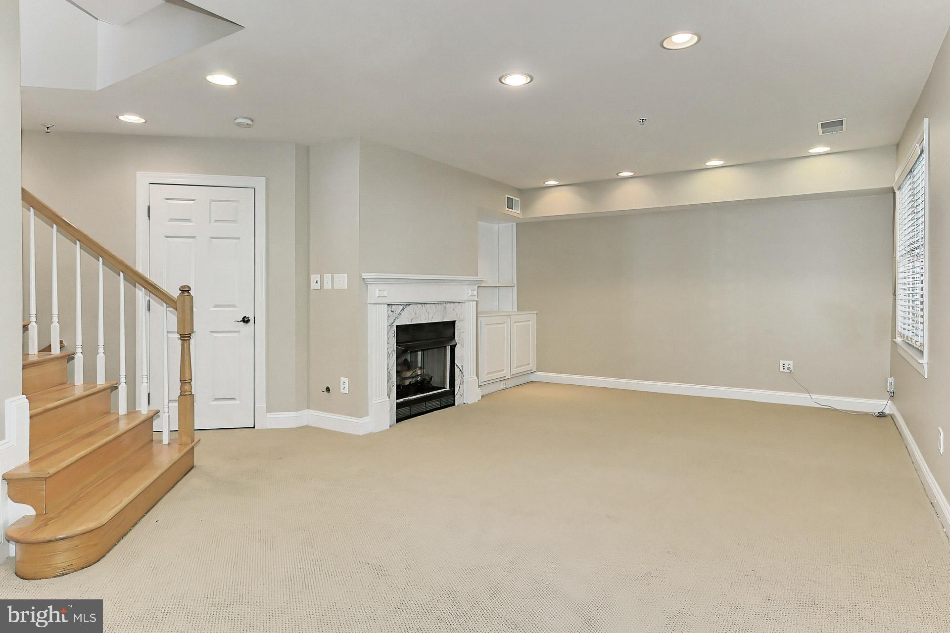 12131 Chancery Station Circle Reston, VA 20190 - Photo 50 of 66 Walk ou lower level with fireplace and built ins