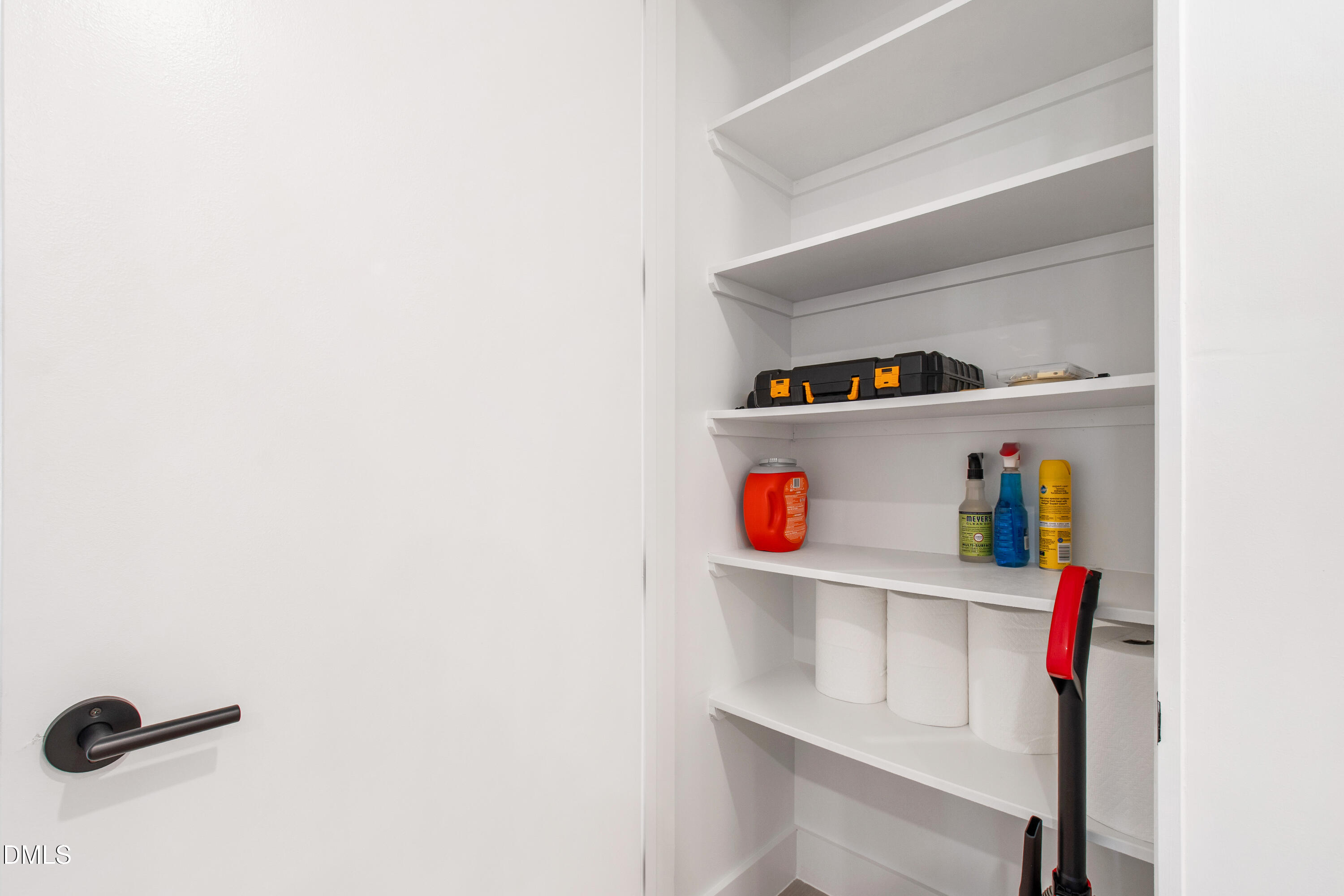 29 Enterprise Street, Unit 211 Raleigh, NC 27607 - Photo 23 of 48 a hallway with white cabinets