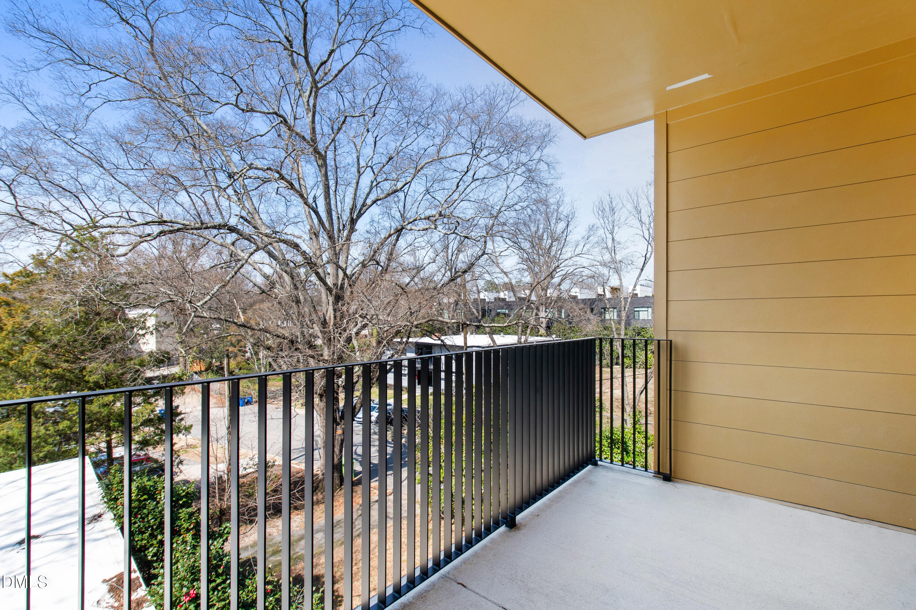 29 Enterprise Street, Unit 211 Raleigh, NC 27607 - Photo 36 of 48 a view of a gate and trees from a terrace