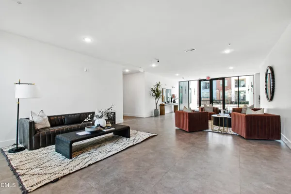 a living room with furniture rug and couch