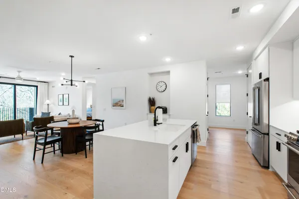 a kitchen with sink cabinets and stove