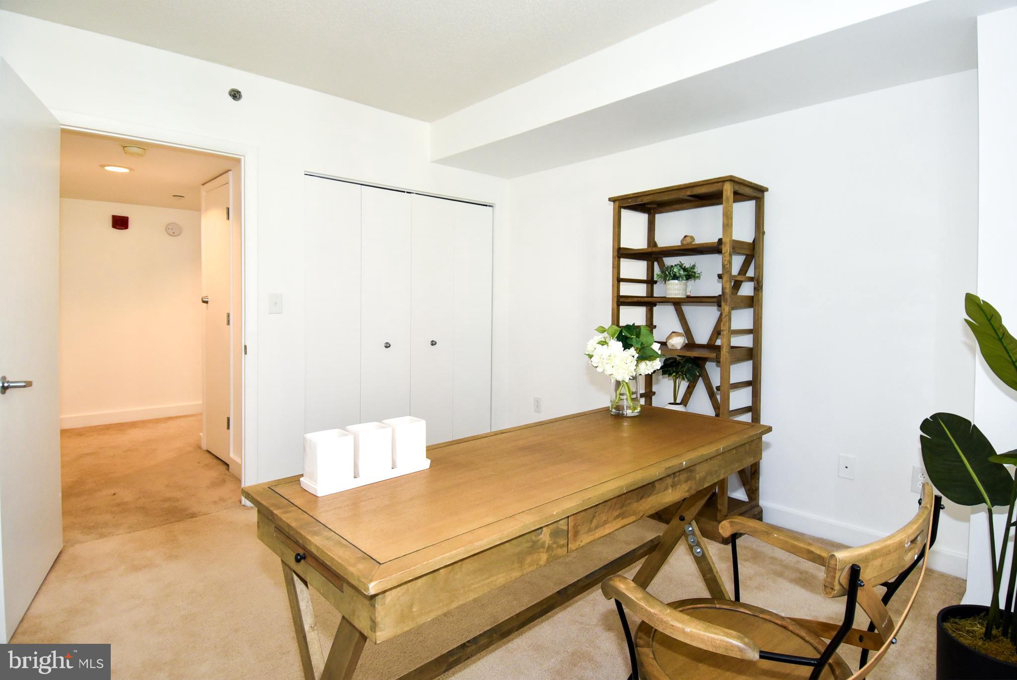 1150 K Street Northwest, Unit 408 Washington, DC 20005 - Photo 21 of 32 a view of a room with furniture and wooden floor