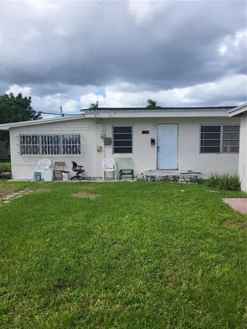 a house view with a garden space