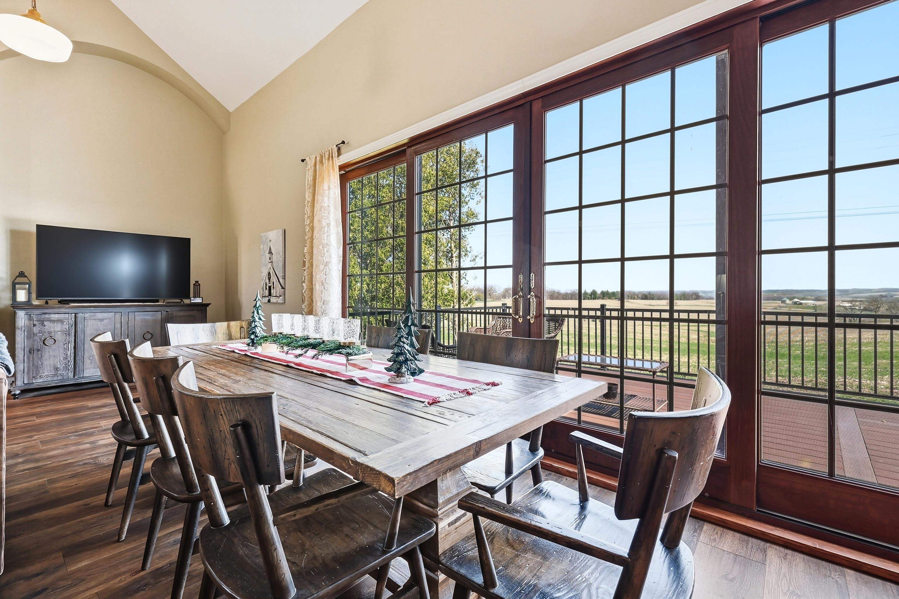6603 West Council Hill Road Scales Mound, IL 61075 - Photo 16 of 49 a view of a dining room with furniture window and wooden floor