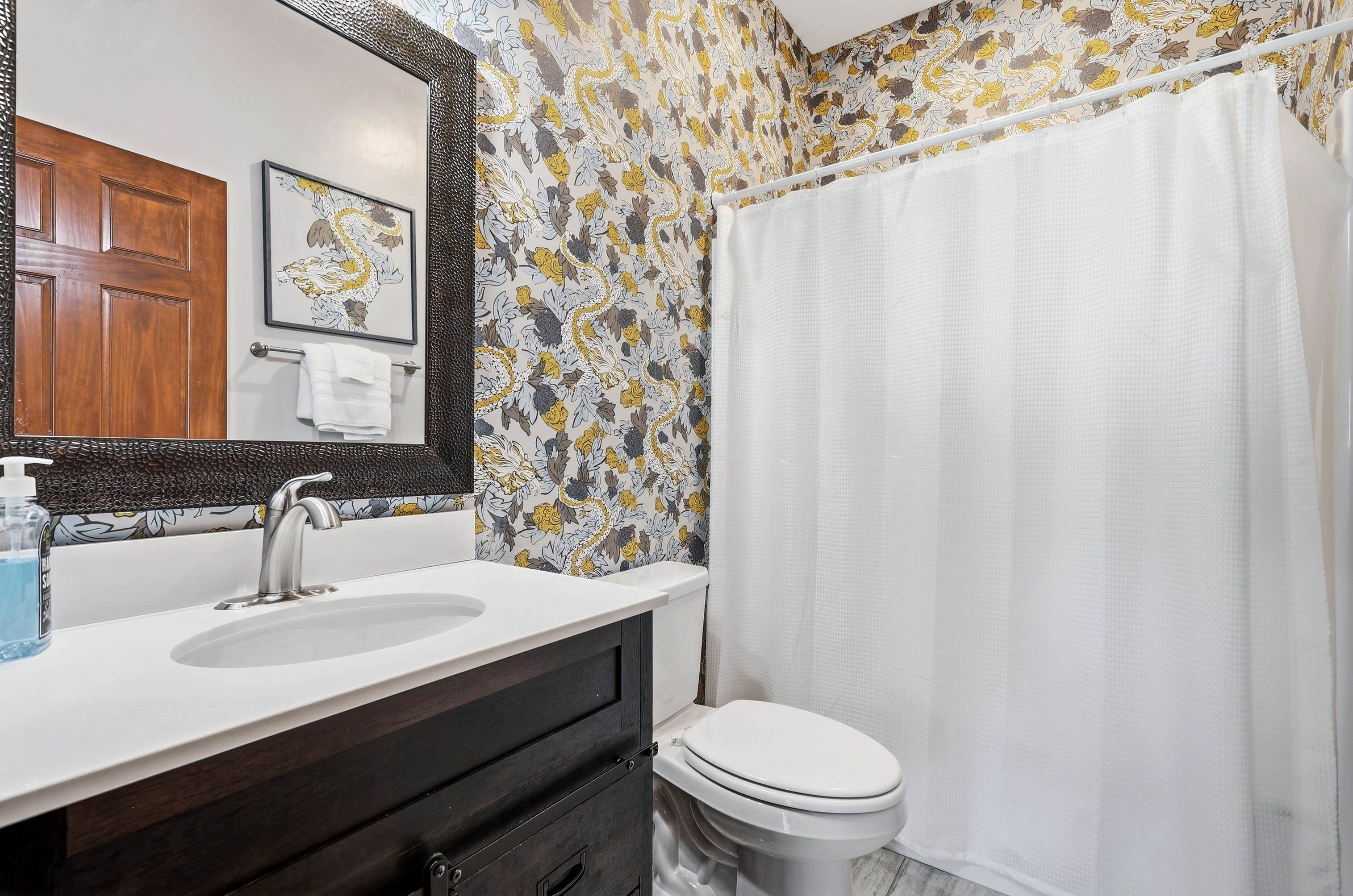 6603 West Council Hill Road Scales Mound, IL 61075 - Photo 25 of 49 a bathroom with a sink toilet and a mirror