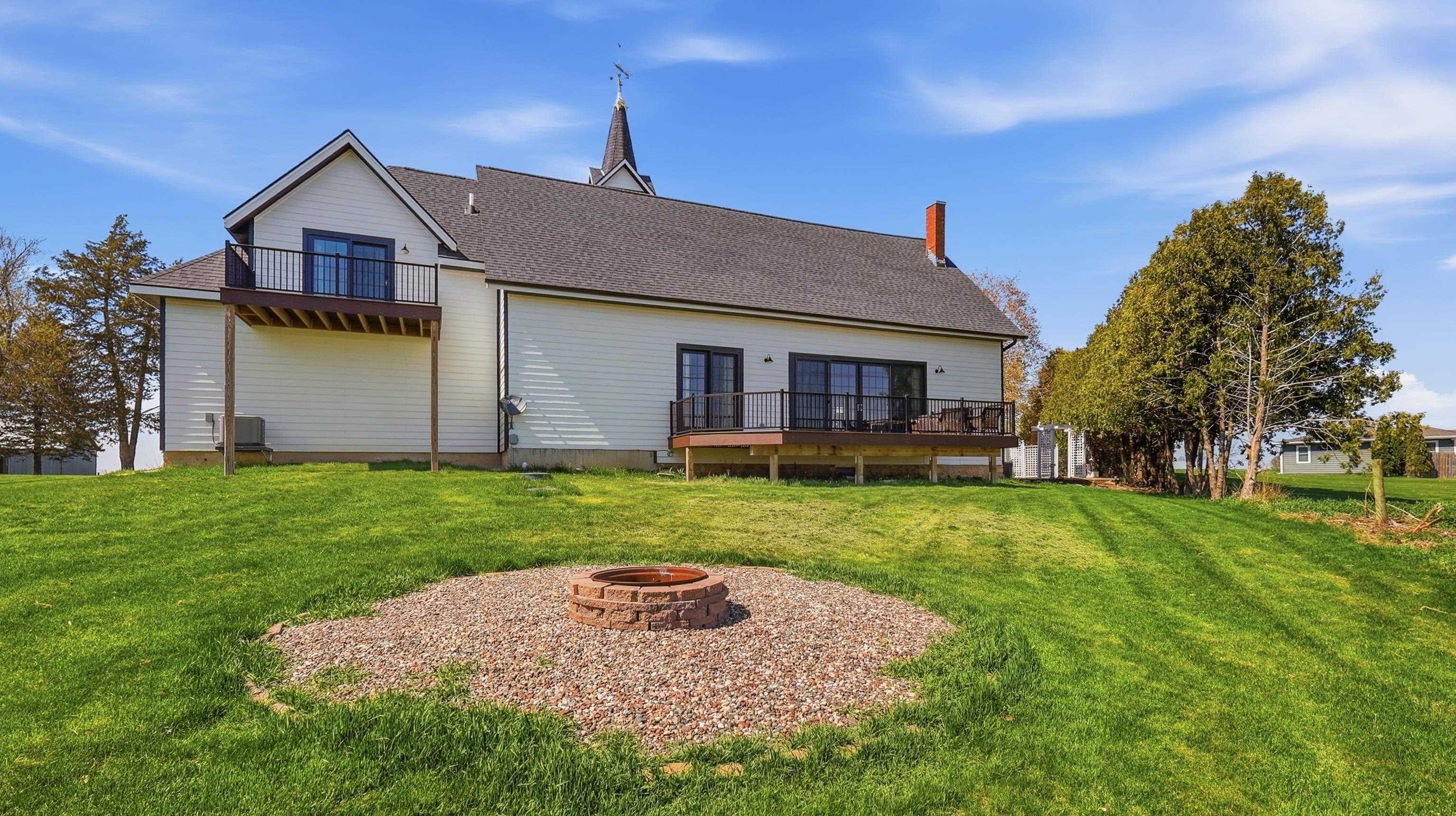 6603 West Council Hill Road Scales Mound, IL 61075 - Photo 45 of 49 a front view of a house with a yard and trees