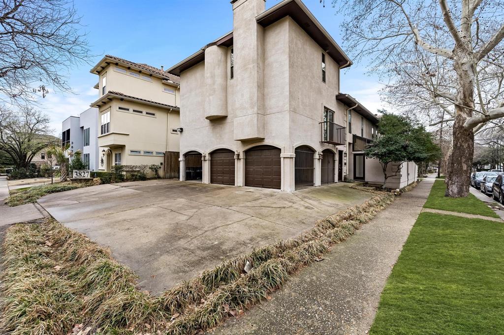 a view of a white house with a yard