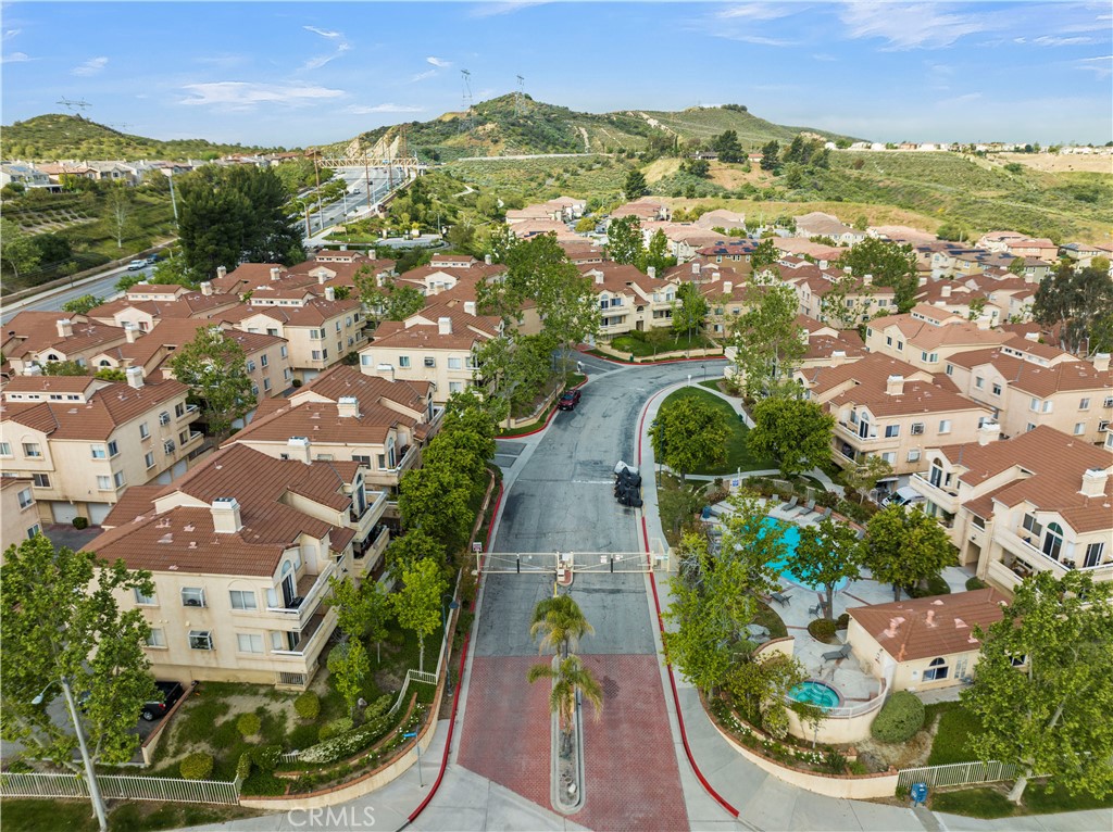 19847 Sandpiper Place, Unit 139 Newhall, CA 91321 - Photo 11 of 50 an aerial view of residential houses with outdoor space and trees