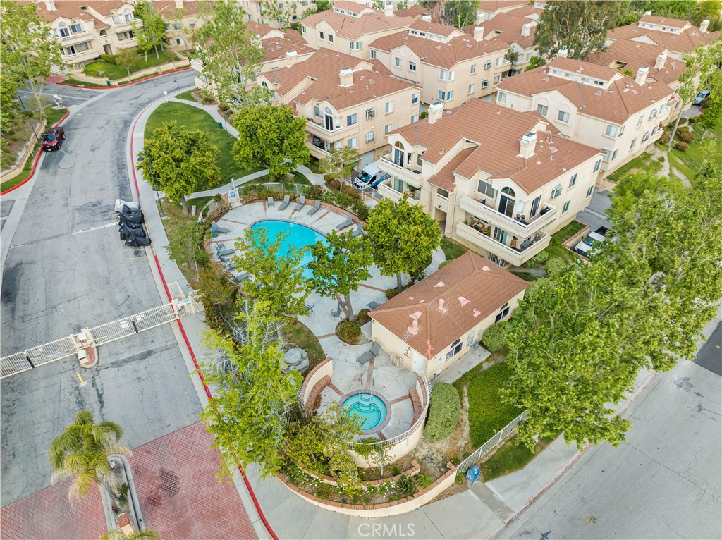 19847 Sandpiper Place, Unit 139 Newhall, CA 91321 - Photo 3 of 50 an aerial view of a house with a yard and potted plants