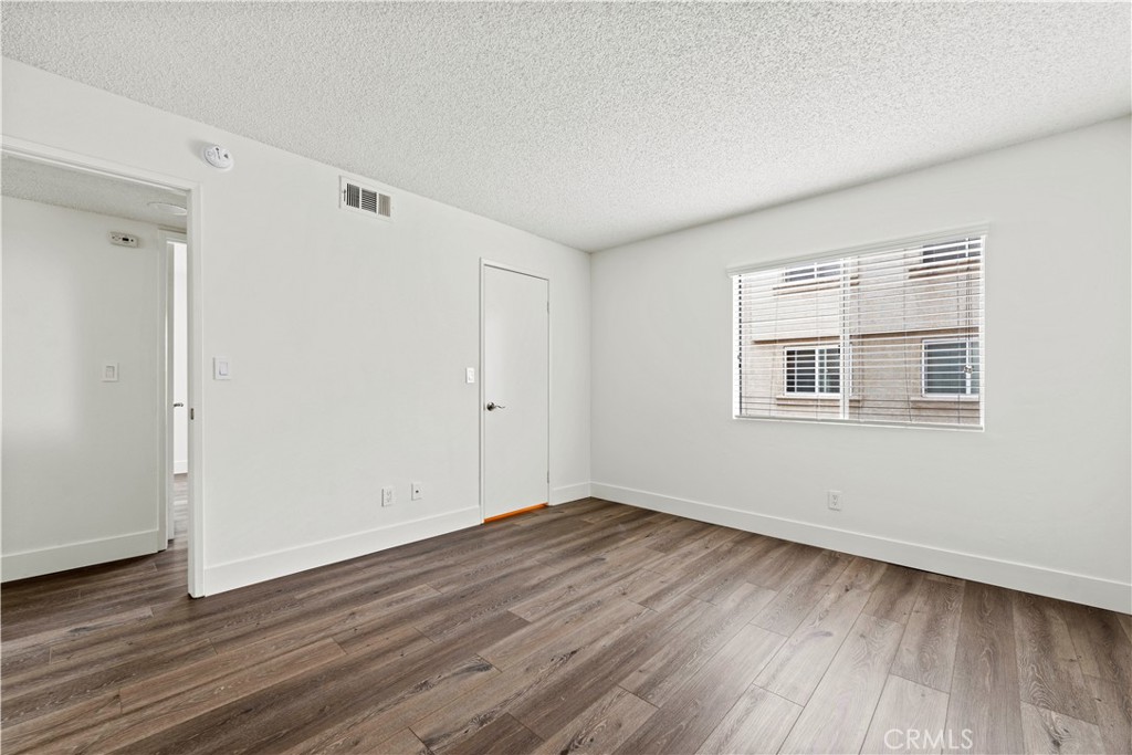 19847 Sandpiper Place, Unit 139 Newhall, CA 91321 - Photo 46 of 50 a view of empty room with wooden floor and fan