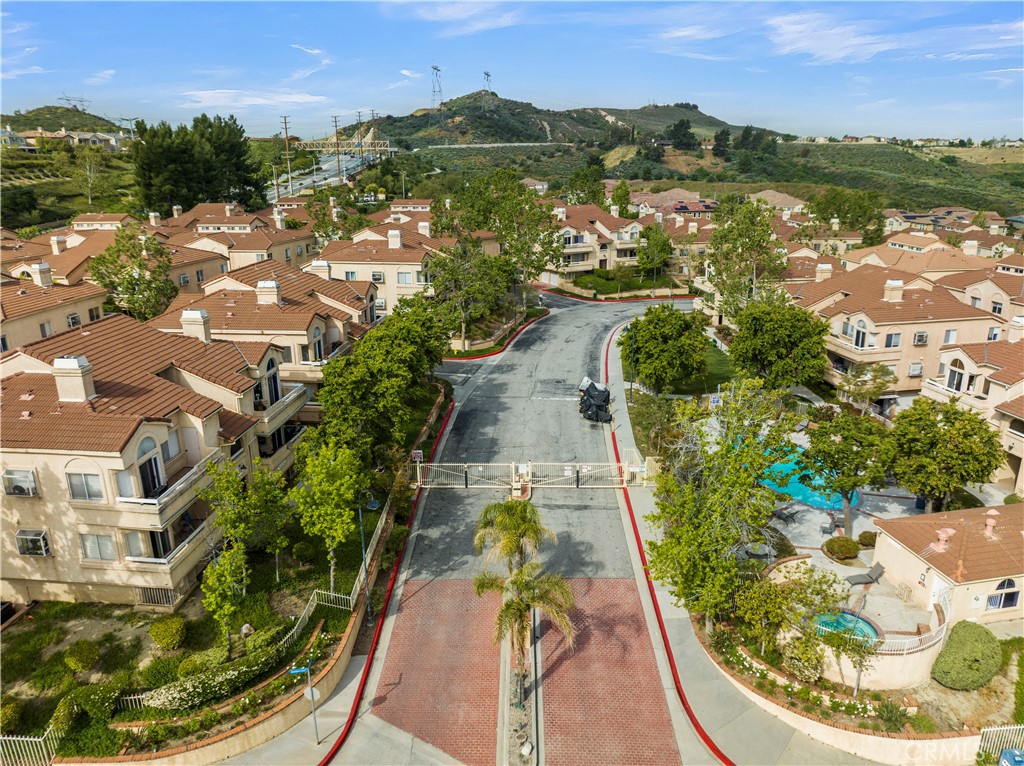 19847 Sandpiper Place, Unit 139 Newhall, CA 91321 - Photo 6 of 50 an aerial view of residential houses with outdoor space and swimming pool