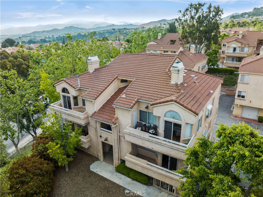 19847 Sandpiper Place, Unit 139 Newhall, CA 91321 - Photo 8 of 50 a aerial view of a house with a yard