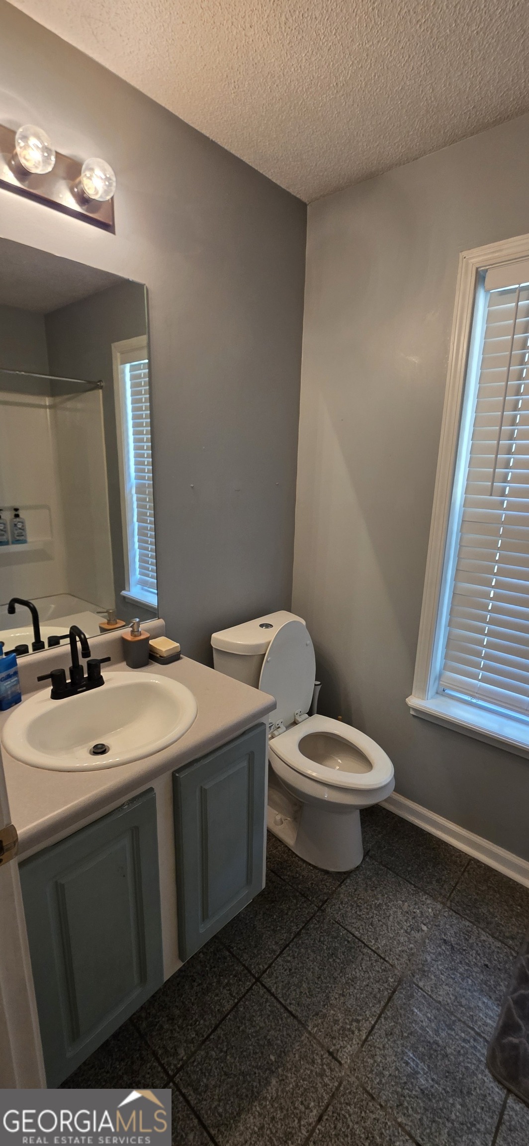 140 Villa Rosa Road Temple, GA 30179 - Photo 11 of 22 a bathroom with a toilet sink and mirror
