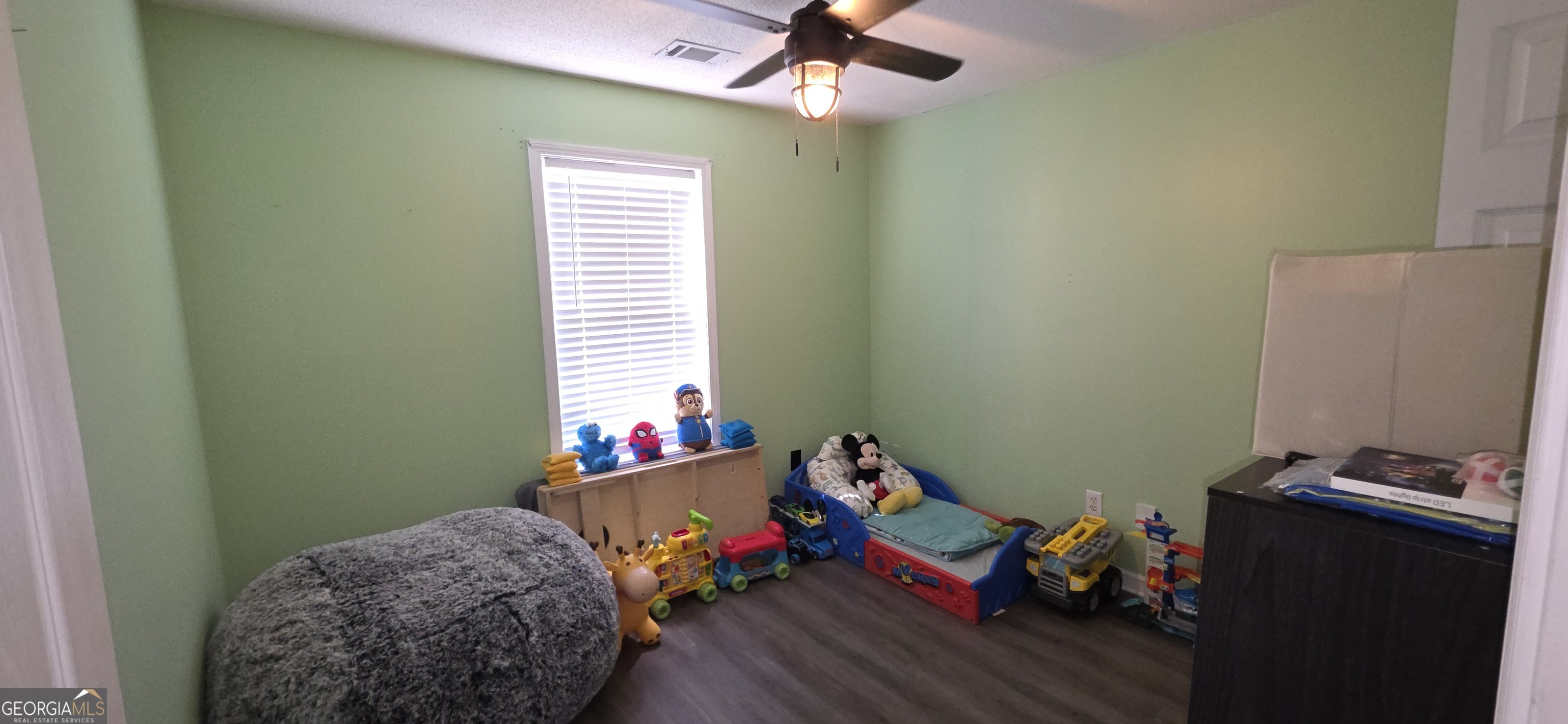 140 Villa Rosa Road Temple, GA 30179 - Photo 16 of 22 a bedroom with a bed and wooden floor