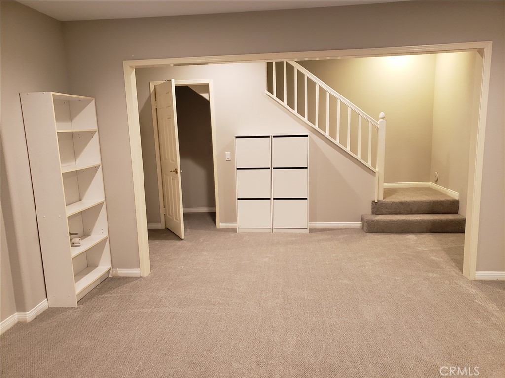 2447 Oneida Street, Unit 2 Pasadena, CA 91107 - Photo 51 of 56 View from Bonus room to storage closet, shoe cupboard & stairwell to main level, garage to left