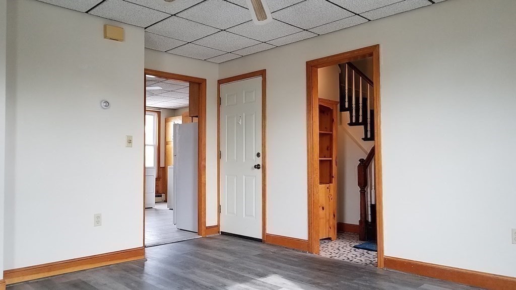 38-40 Pleasant Street Reading, MA 01867 - Photo 14 of 25 an empty room with wooden floor and closet
