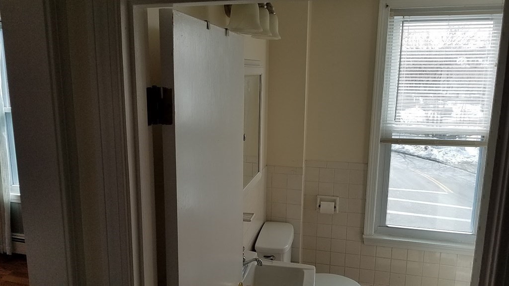 38-40 Pleasant Street Reading, MA 01867 - Photo 16 of 25 a bathroom with a window