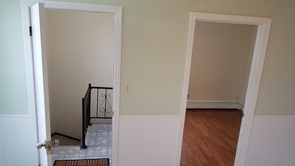 38-40 Pleasant Street Reading, MA 01867 - Photo 17 of 25 a view of front door with hallway