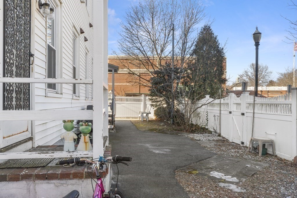 38-40 Pleasant Street Reading, MA 01867 - Photo 20 of 25 a view of a street with house