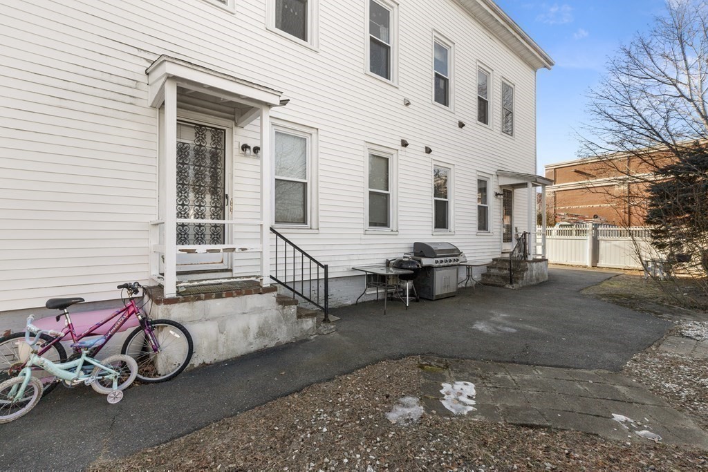 38-40 Pleasant Street Reading, MA 01867 - Photo 21 of 25 a view of a car park in front of house