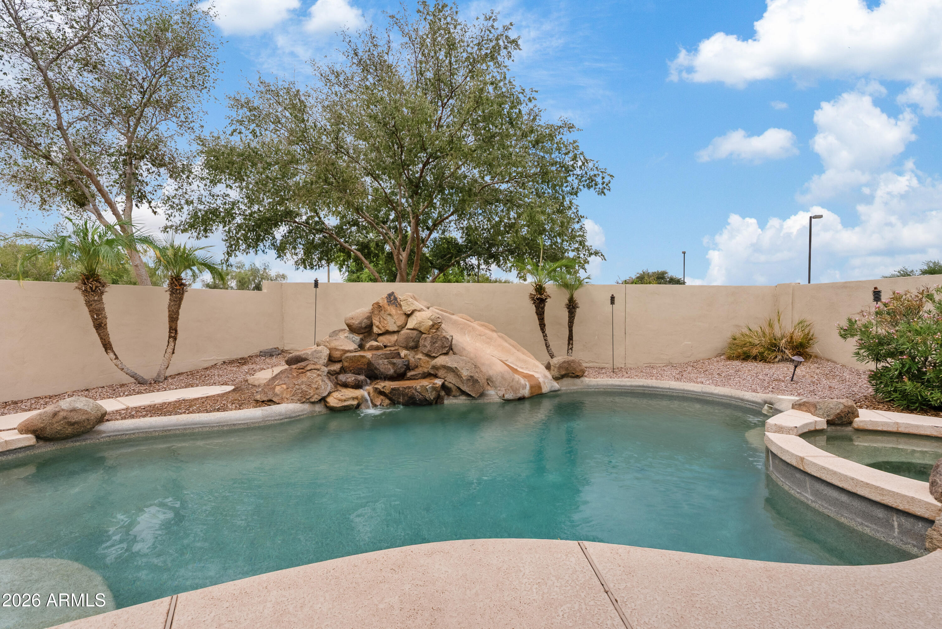 6280 South Sinova Court Gilbert, AZ 85298 - Photo 37 of 58 Sparkling pool with Spa and Waterfall
