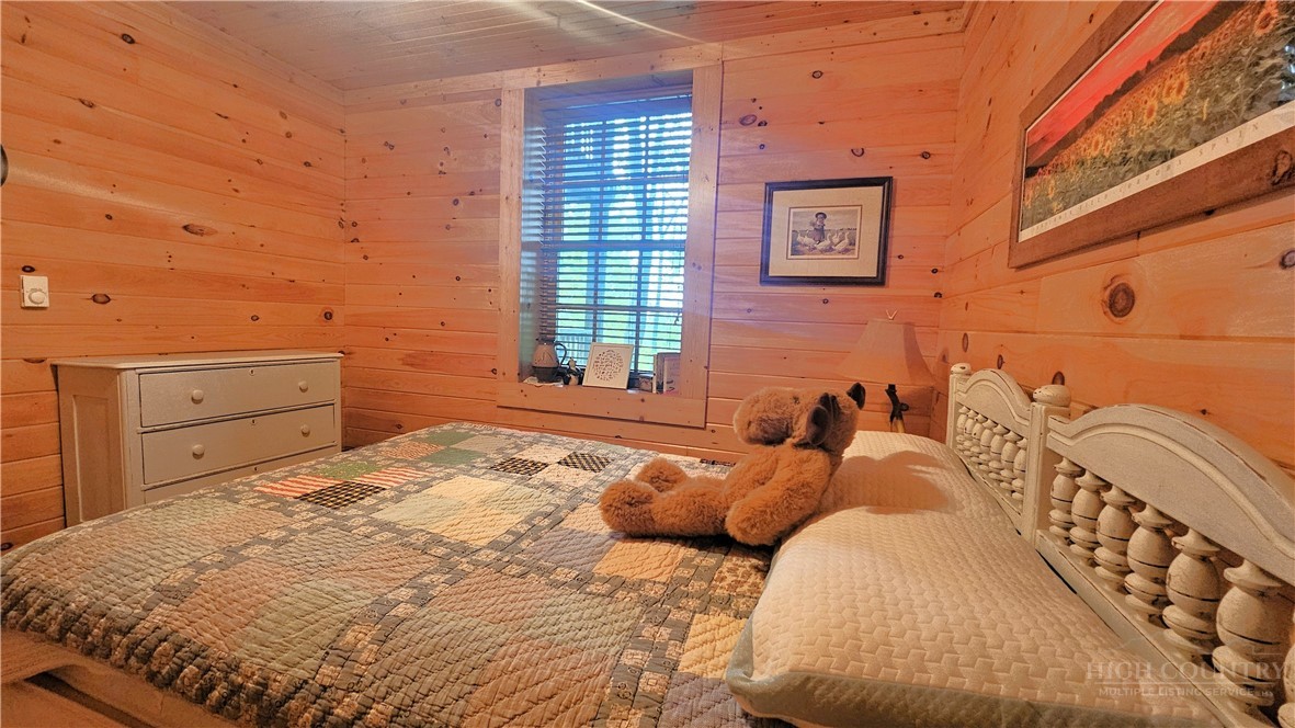 3043 Junaluska Road Boone, NC 28607 - Photo 37 of 49 a bedroom with a bed and with furniture