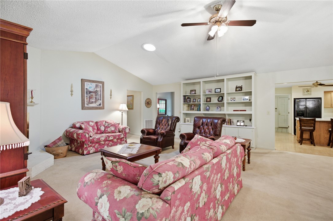 6 Tradewinds Way Salem, SC 29676 - Photo 4 of 50 This inviting living space features built-in shelving, vaulted ceilings, and opens to a functional kitchen.
