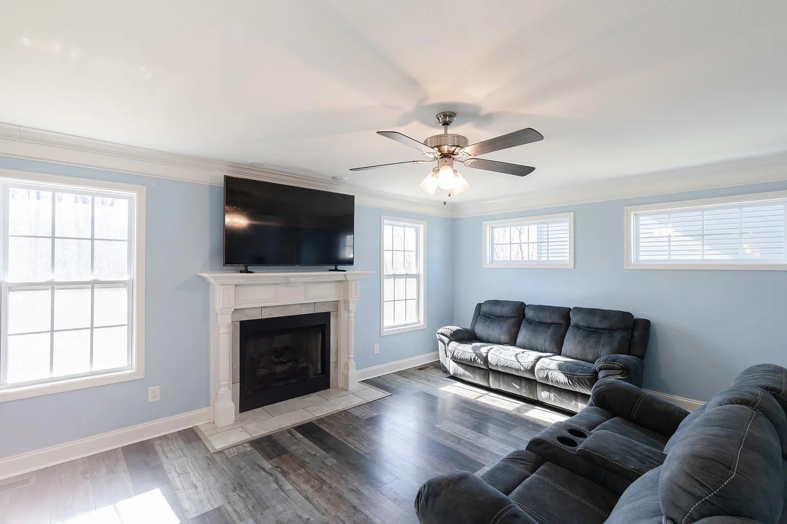 1839 Rains Road Clarksville, TN 37042 - Photo 6 of 22 a living room with furniture a flat screen tv and a fireplace