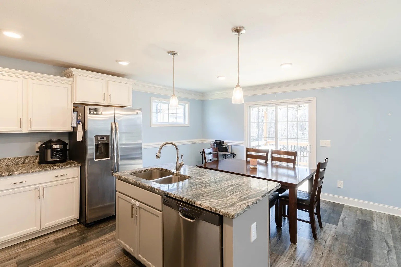 1839 Rains Road Clarksville, TN 37042 - Photo 7 of 22 a kitchen with granite countertop a sink a counter space appliances and cabinets