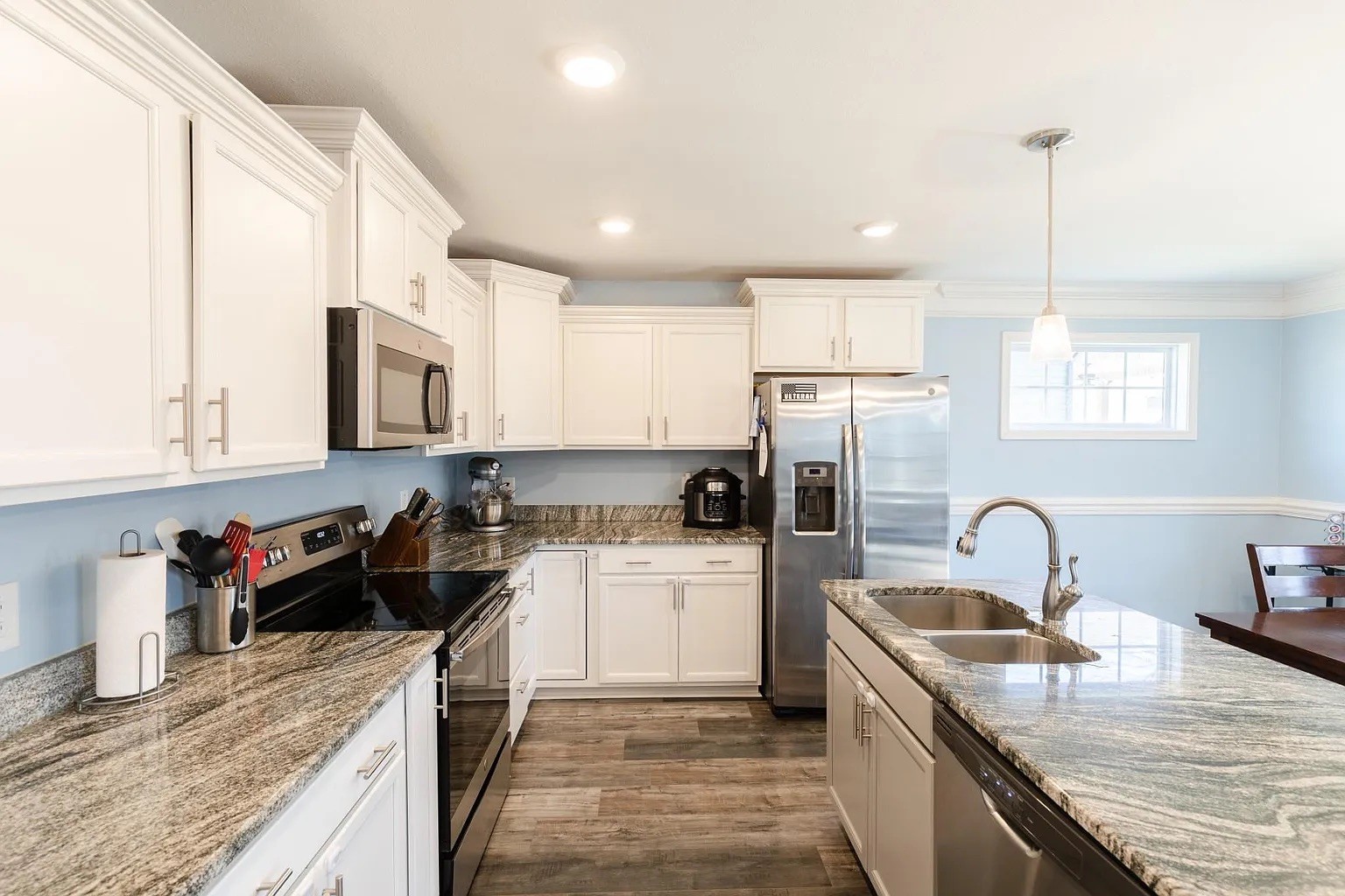 1839 Rains Road Clarksville, TN 37042 - Photo 8 of 22 a kitchen with a sink stove top oven and refrigerator