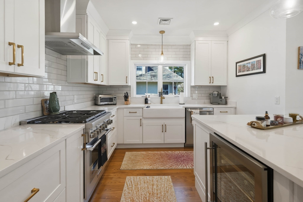 20 Lawrence Street, Unit 2 Wakefield, MA 01880 - Photo 13 of 38 a kitchen with a sink stove and cabinets