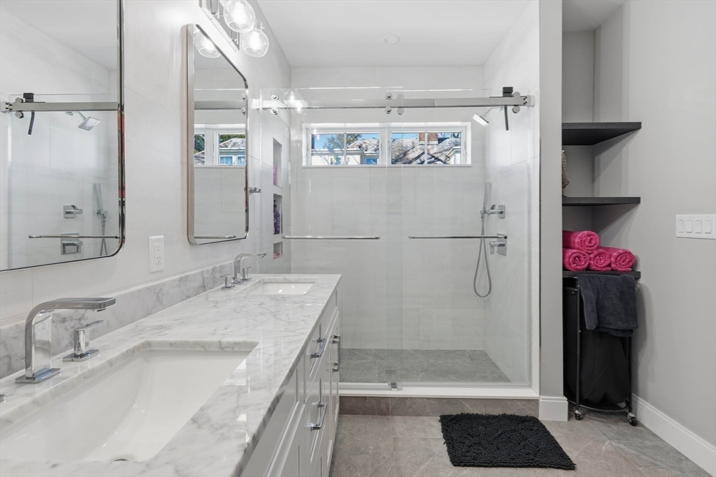 20 Lawrence Street, Unit 2 Wakefield, MA 01880 - Photo 27 of 38 a bathroom with a tub sink and shower
