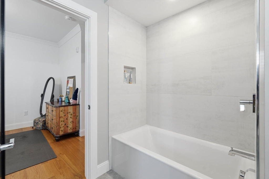 20 Lawrence Street, Unit 2 Wakefield, MA 01880 - Photo 31 of 38 a bathroom with a tub