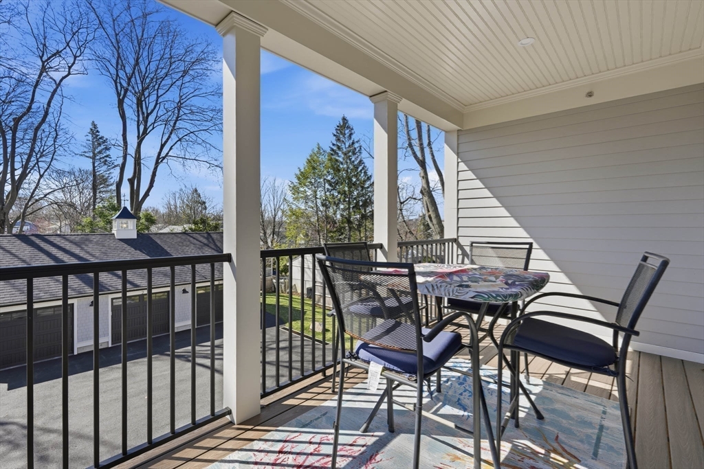 20 Lawrence Street, Unit 2 Wakefield, MA 01880 - Photo 33 of 38 a view of a chairs and table in the balcony