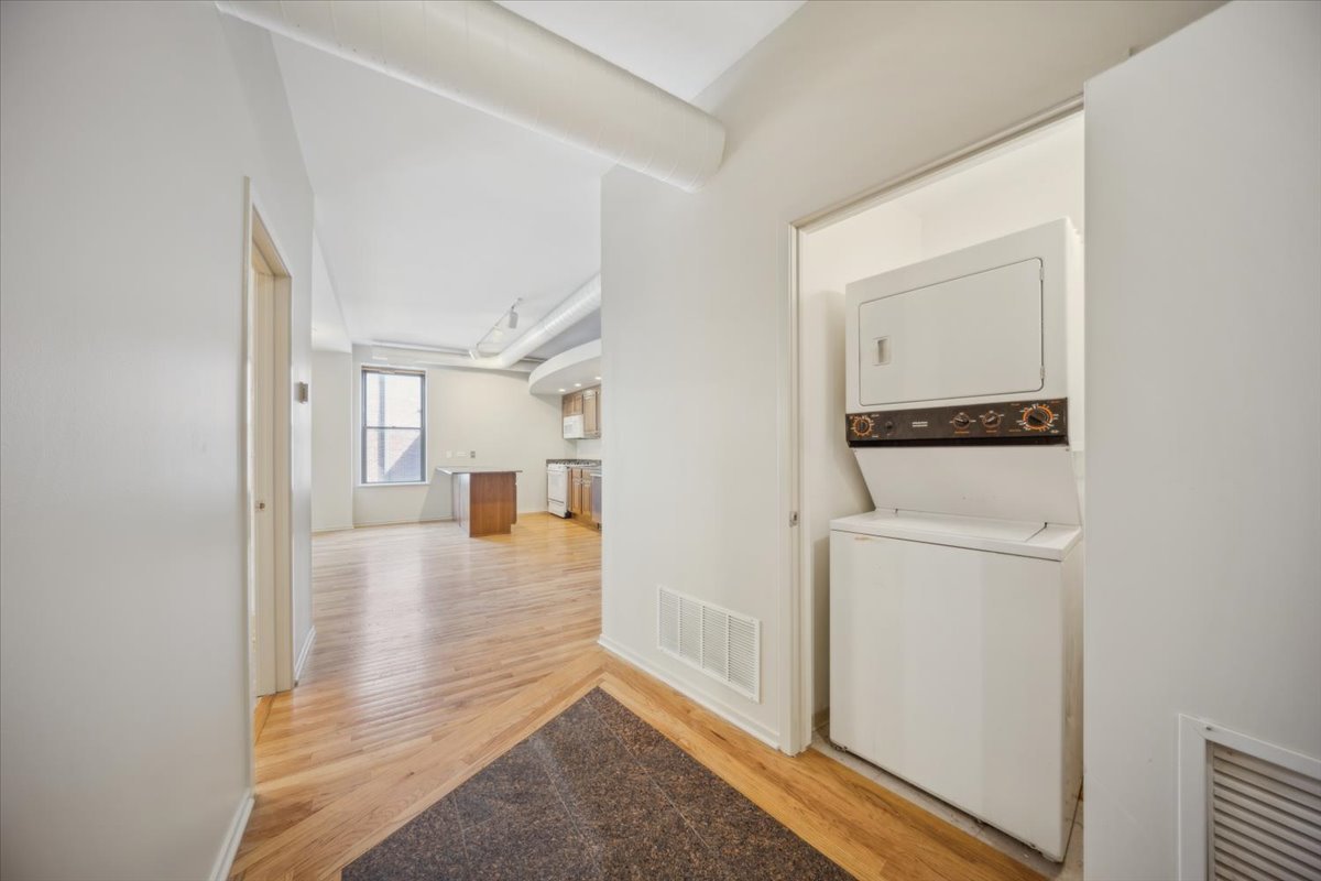 811 South Lytle Street, Unit 101 Chicago, IL 60607 - Photo 11 of 23 a view of a hallway with bathroom and wooden floor