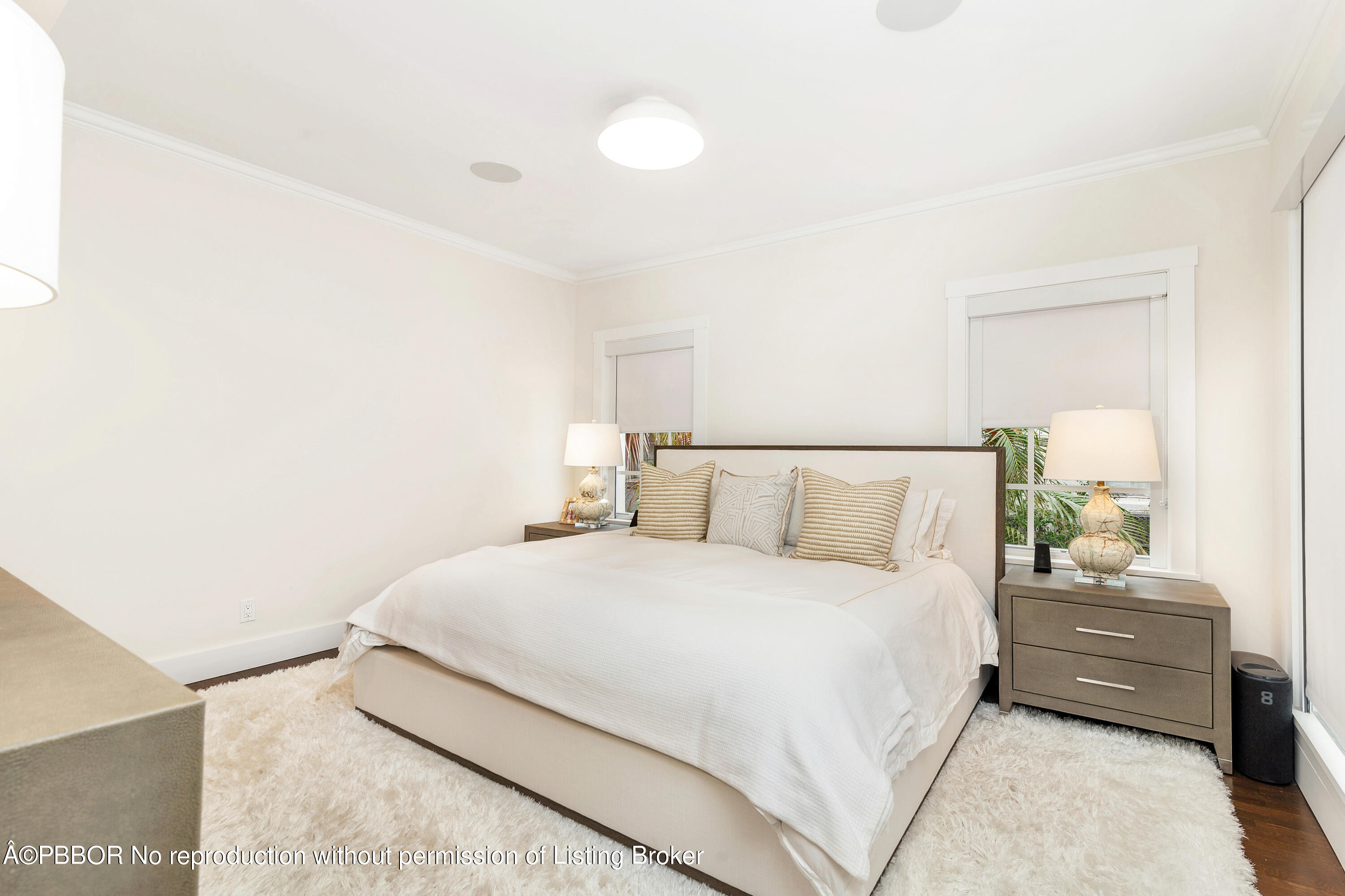 231 Sunset Road West Palm Beach, FL 33401 - Photo 11 of 22 a bedroom with a bed and a lamp