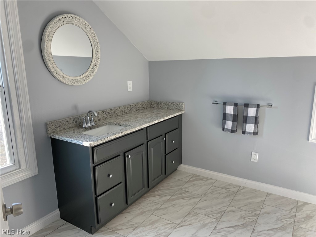 1147 Richmond Road Cleveland, OH 44124 - Photo 21 of 28 Bathroom with vanity, vaulted ceiling, and tile floors
