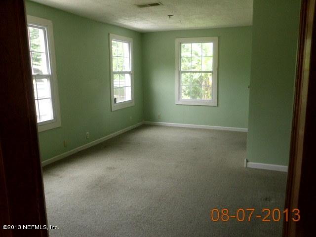 1835 Lilly Road East Jacksonville, FL 32207 - Photo 3 of 11 a view of an empty room with a window