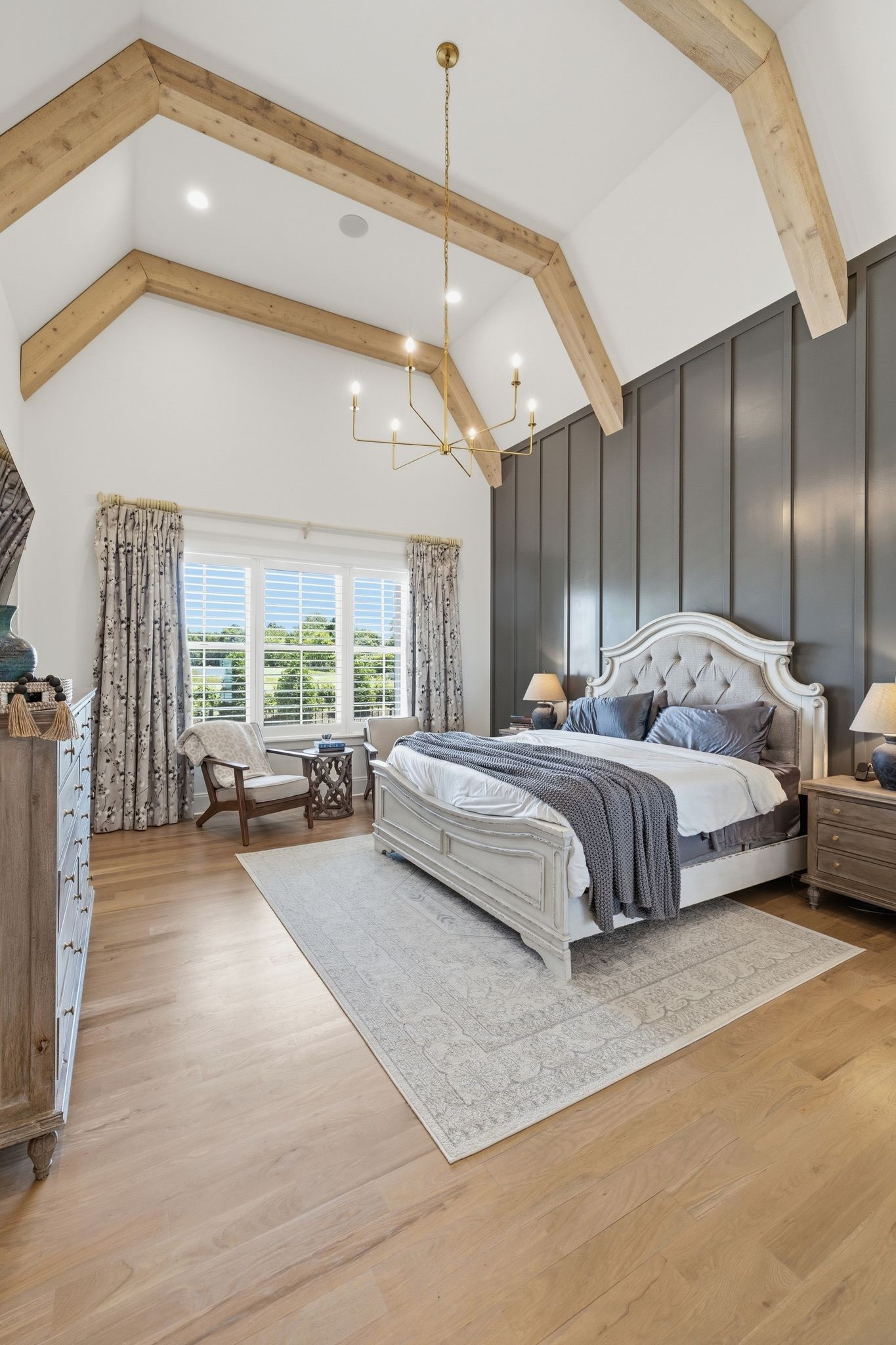 1733 Rigsby Avenue Murfreesboro, TN 37129 - Photo 22 of 57 a bedroom with a large bed and a chandelier