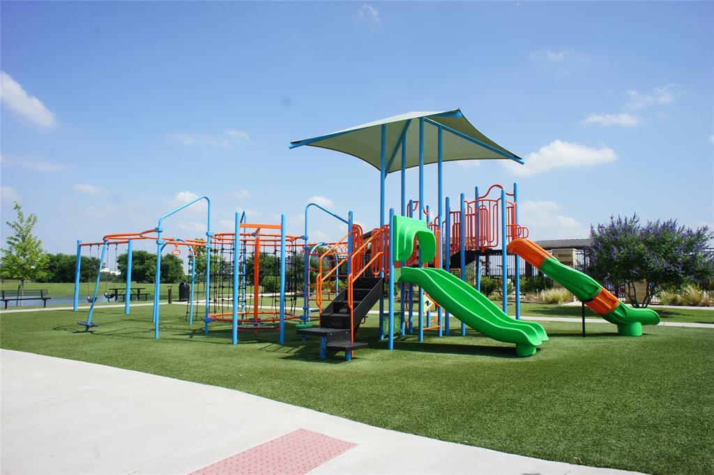 16428 Milwaukee Street Justin, TX 76247 - Photo 12 of 16 a view of a park with a slide and potted plants