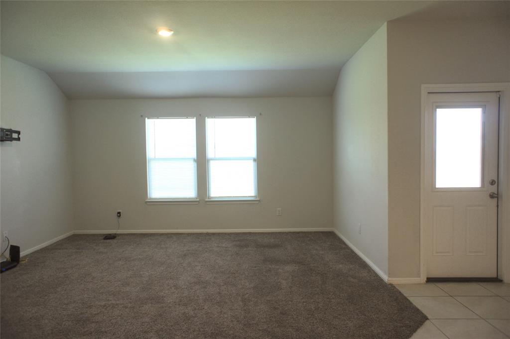 16428 Milwaukee Street Justin, TX 76247 - Photo 7 of 16 an empty room with a window