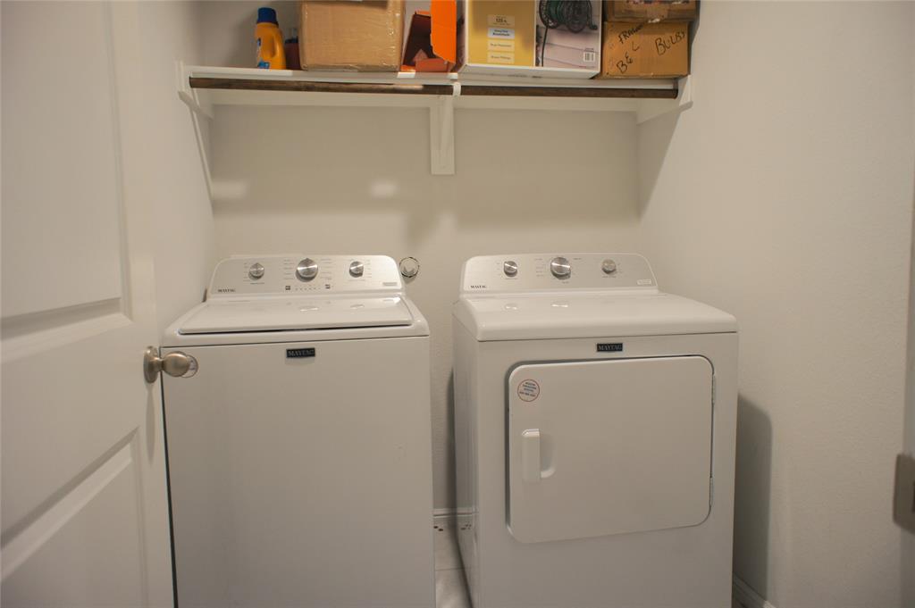 16428 Milwaukee Street Justin, TX 76247 - Photo 10 of 16 a utility room with dryer and washer