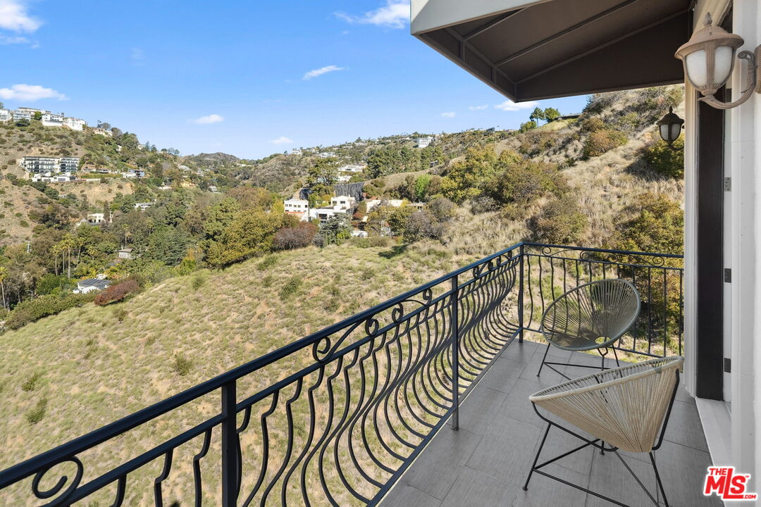 8031 Floral Avenue Los Angeles, CA 90046 - Photo 14 of 34 a view of a balcony with furniture and city view