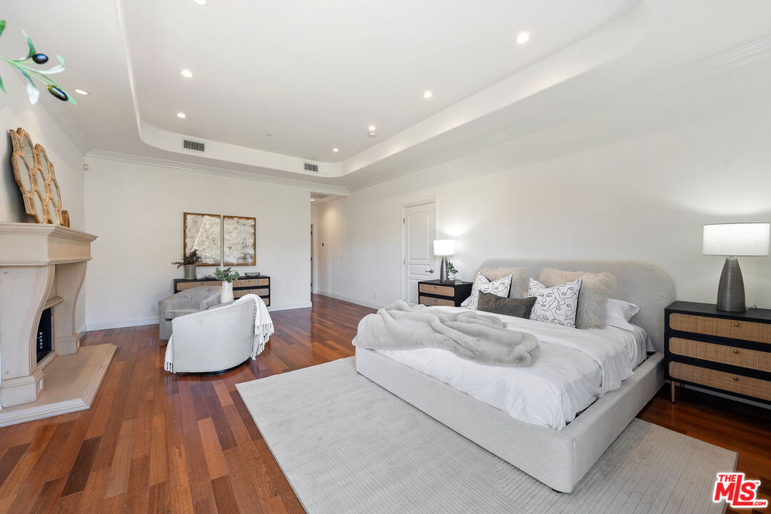 8031 Floral Avenue Los Angeles, CA 90046 - Photo 22 of 34 a bedroom with furniture and a couch