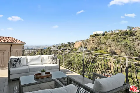 a view of a terrace with furniture