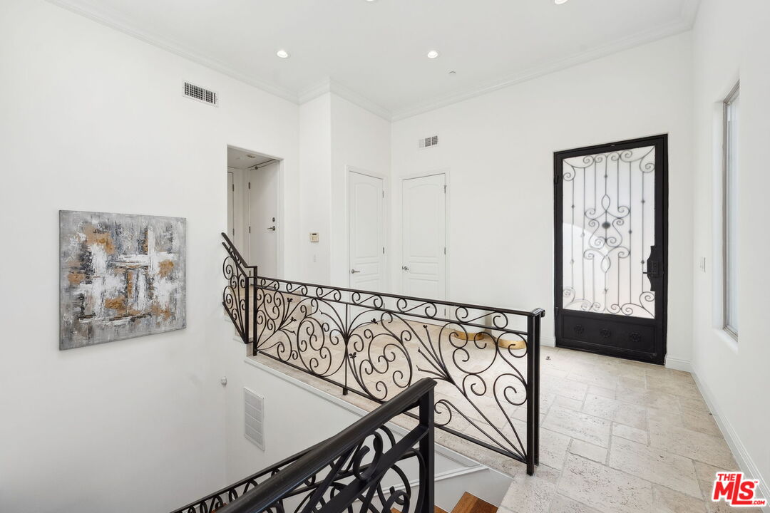 8031 Floral Avenue Los Angeles, CA 90046 - Photo 6 of 34 a view of an entryway with wooden floor