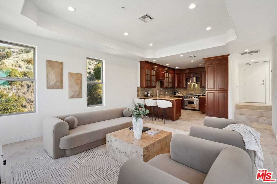 8031 Floral Avenue Los Angeles, CA 90046 - Photo 9 of 34 a living room with furniture and a large window