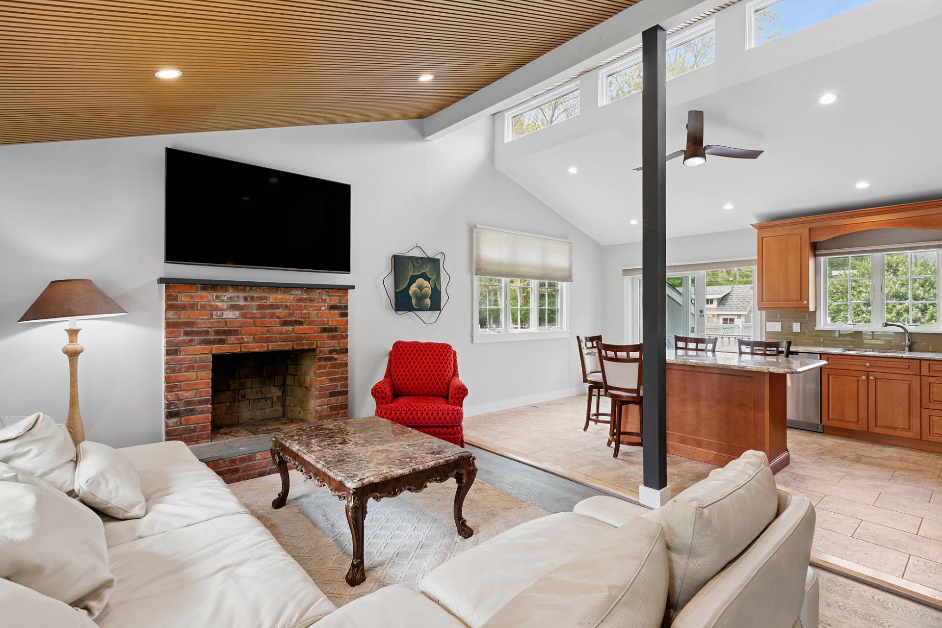 60 Cedar Drive East Hampton, NY 11937 - Photo 4 of 11 a living room with furniture a flat screen tv and a fireplace