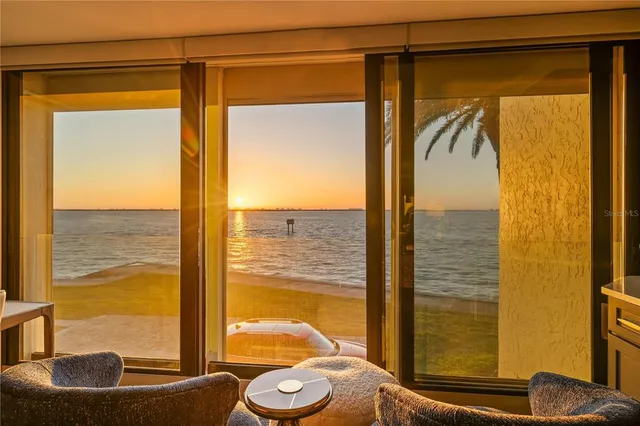 a bathroom with a granite countertop sink and a shower