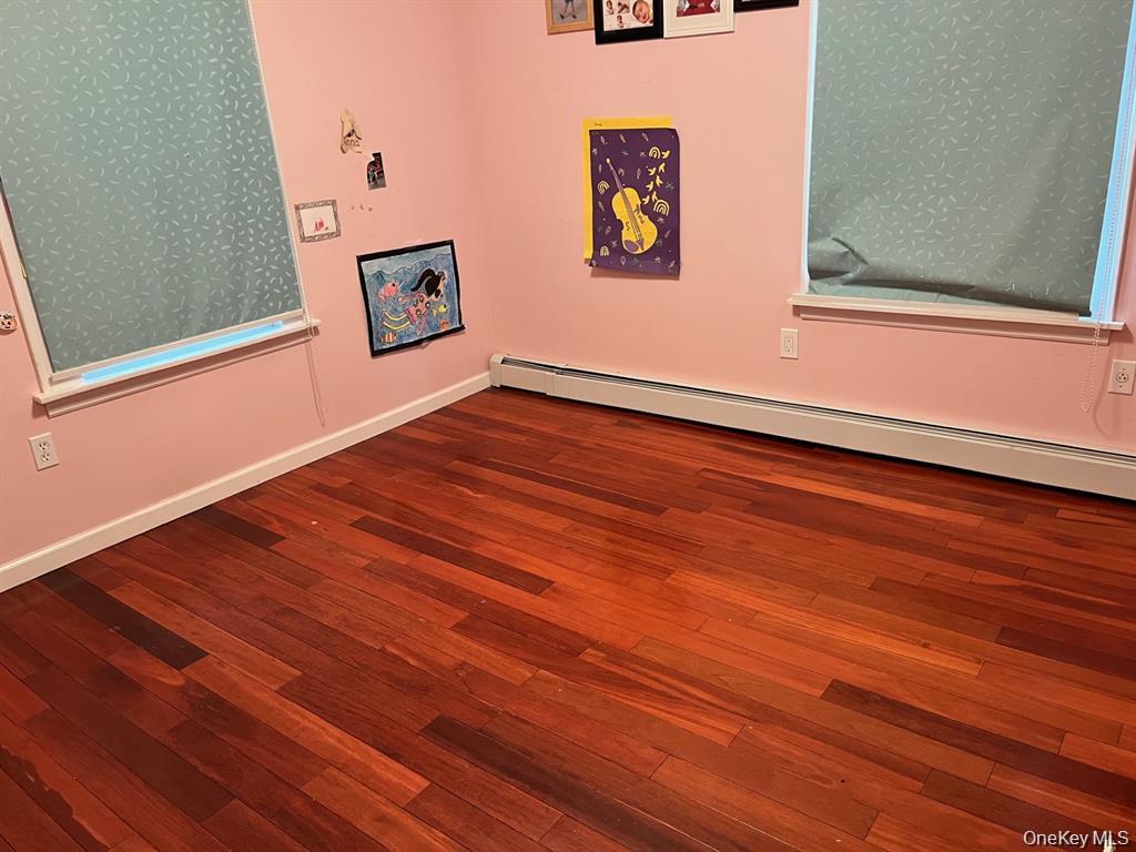 21 Nassau Road Great Neck, NY 11021 - Photo 4 of 9 a view of a hallway with wooden floor